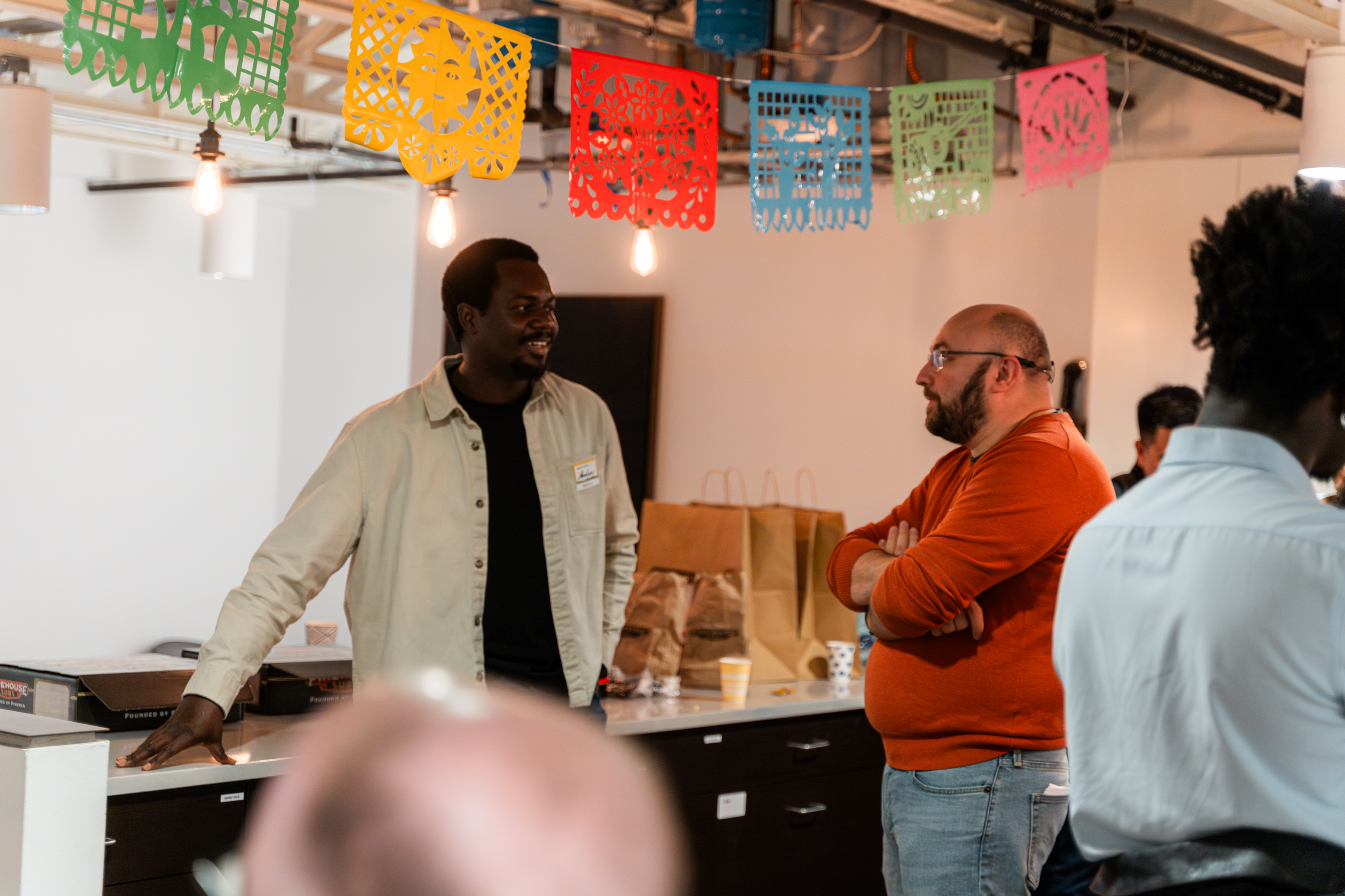 Practitioners networking at a community event